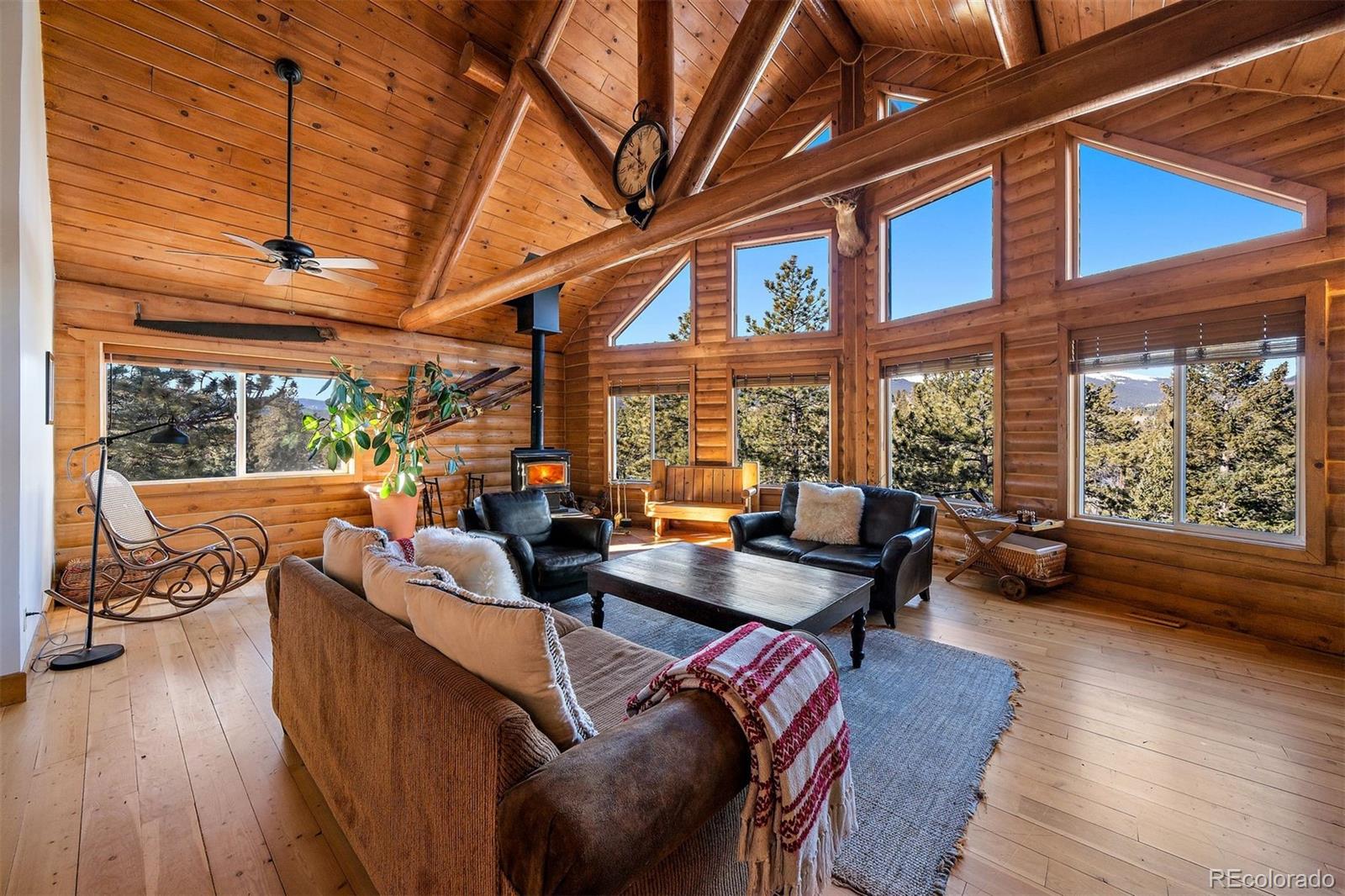 55 Rd P78 Bailey, CO 80421 - Photo 6 of 43 a living room with furniture a wooden floor and a large window