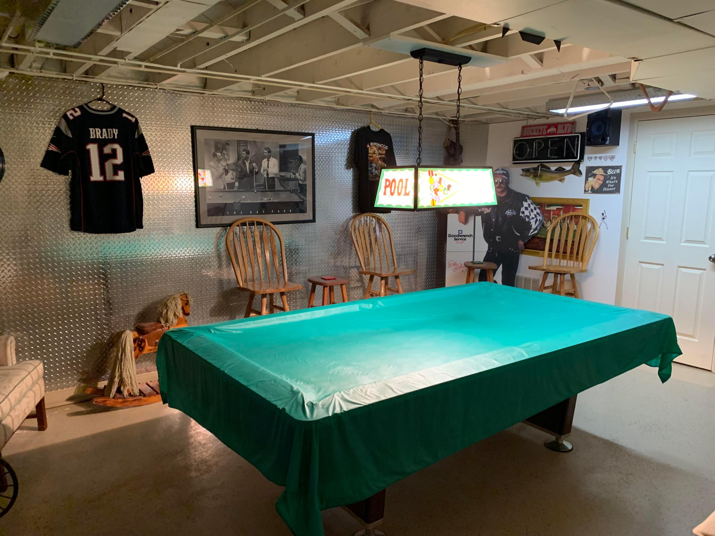 4833 Annhurst Road Columbus, OH 43228 - Photo 23 of 27 man cave. diamond plate wall, storage access. pool table stays