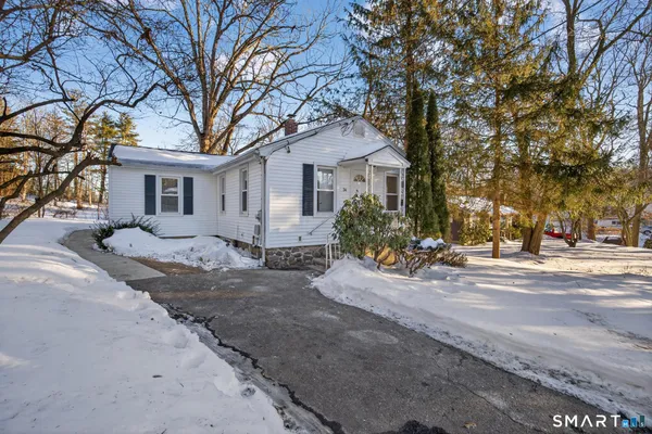 a house with a tree in front of it
