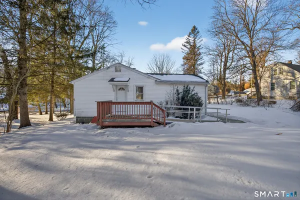 a view of road with large trees