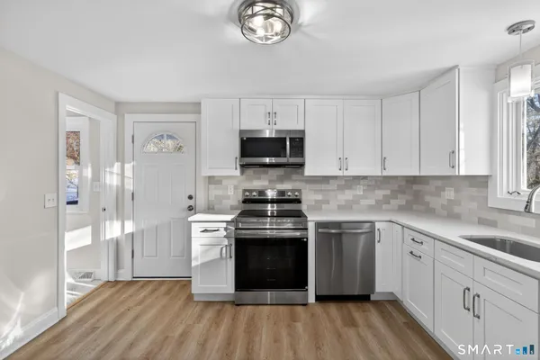 a kitchen with a stove and a sink