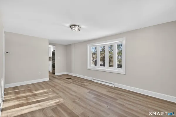 a view of an empty room with a window