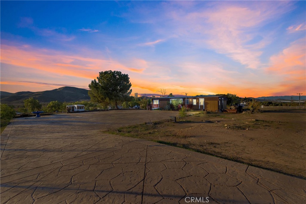 a view of a road with a building in the background