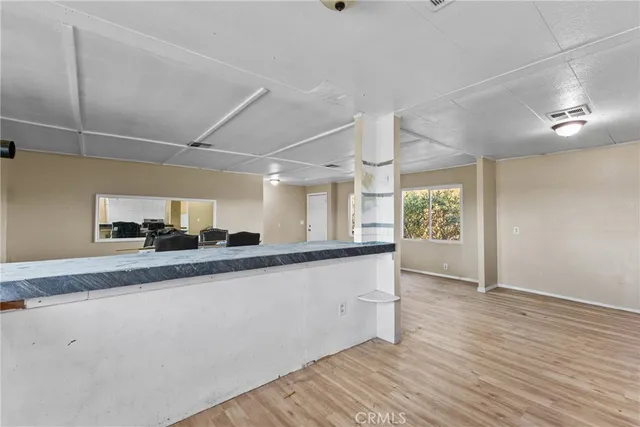 a view of a kitchen with a sink and a window