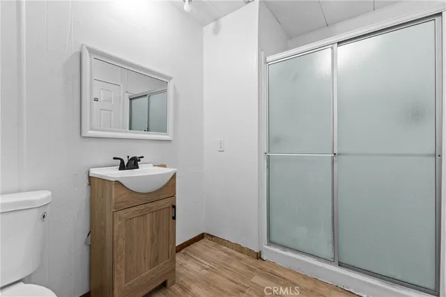 a bathroom with a sink toilet and vanity
