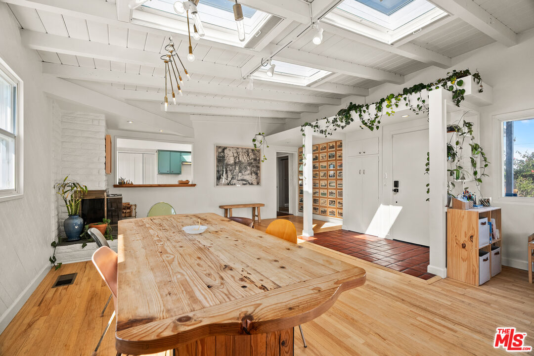 7421 Earldom Avenue Playa del Rey, CA 90293 - Photo 13 of 34 a view of a dining room with furniture and wooden floor
