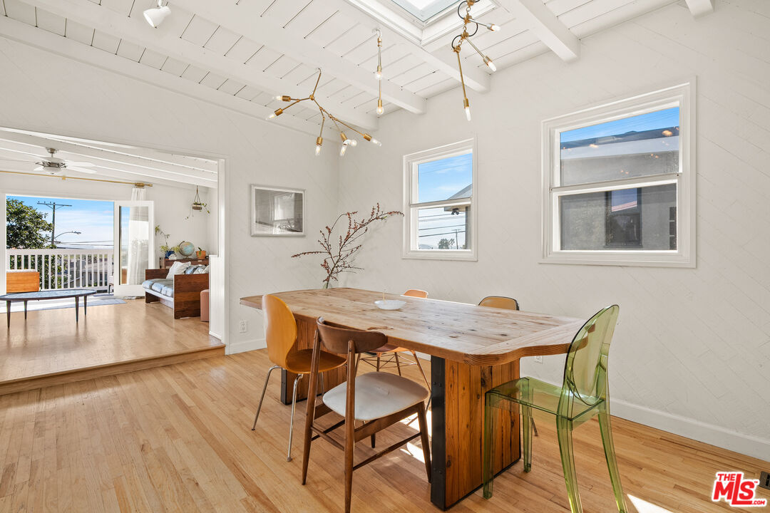 7421 Earldom Avenue Playa del Rey, CA 90293 - Photo 15 of 34 a dining room with furniture and wooden floor