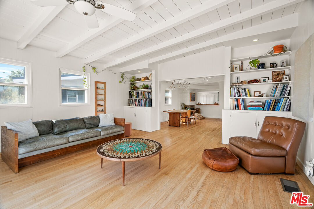 7421 Earldom Avenue Playa del Rey, CA 90293 - Photo 18 of 34 a living room with furniture and a wooden floor