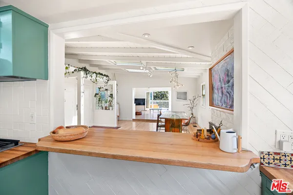 a view of a living room and entry way