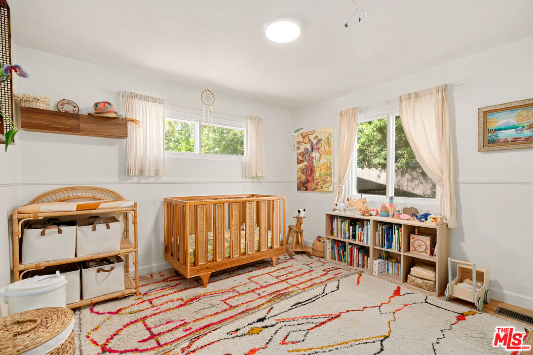 7421 Earldom Avenue Playa del Rey, CA 90293 - Photo 29 of 34 a bedroom with furniture and a window