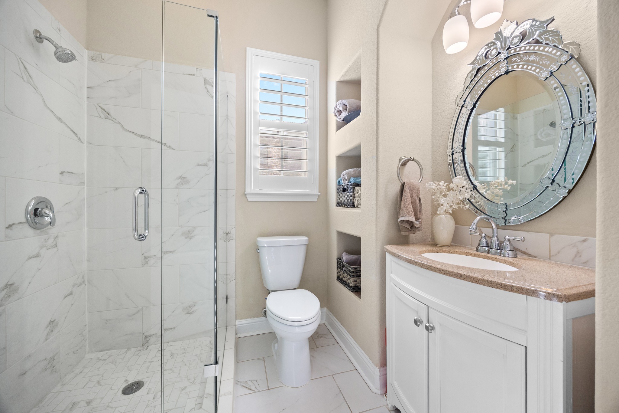 4 Hightrail Way The Hills, TX 78738 - Photo 13 of 35 a bathroom with a sink a toilet and a mirror