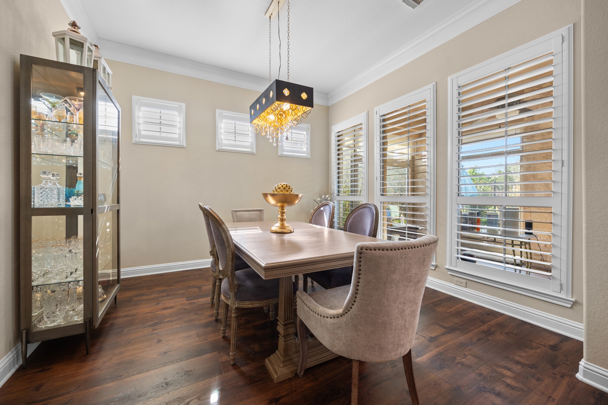 4 Hightrail Way The Hills, TX 78738 - Photo 14 of 35 a view of a dining room with furniture wooden floor and chandelier