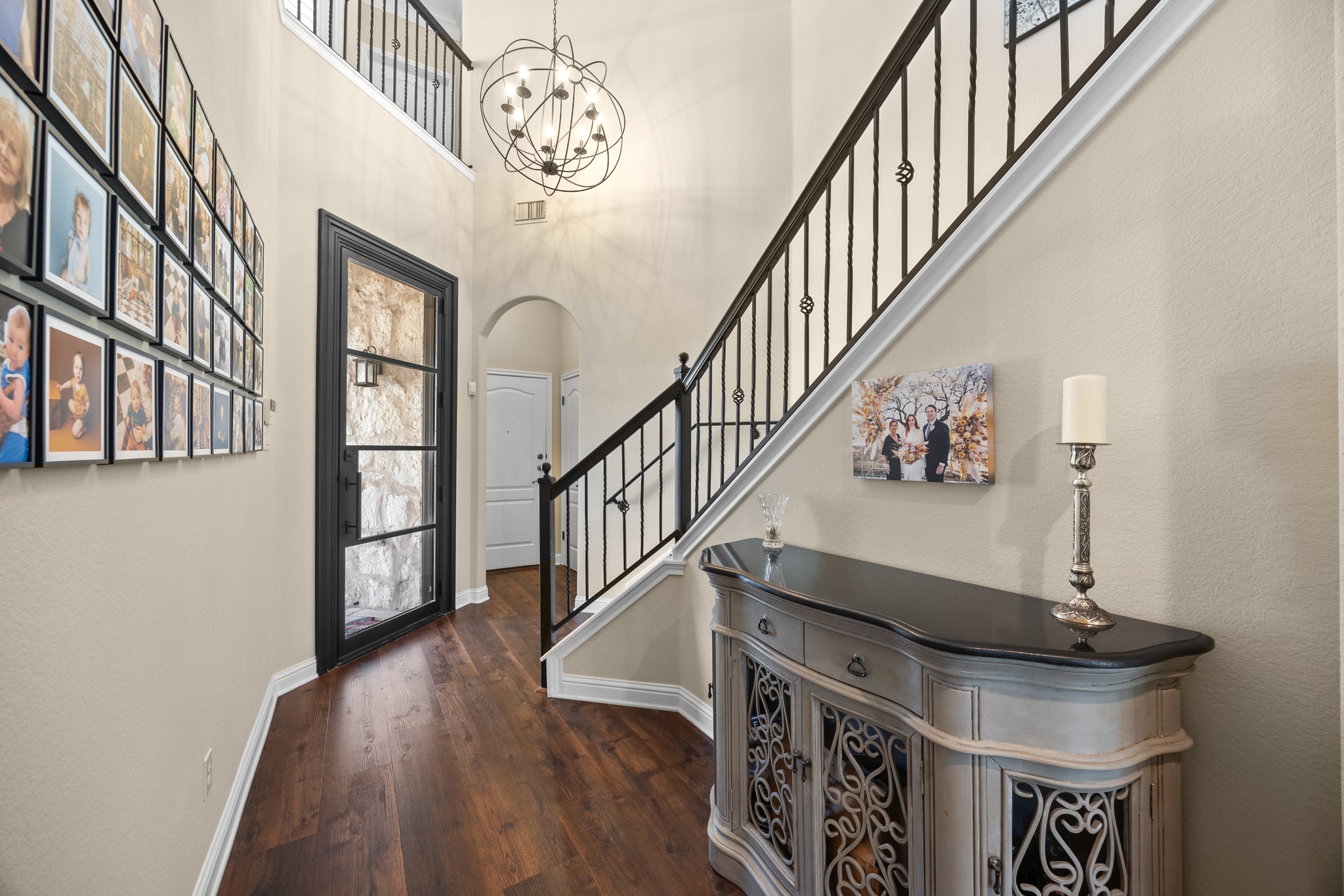 4 Hightrail Way The Hills, TX 78738 - Photo 16 of 35 a view of entryway and hall with wooden floor