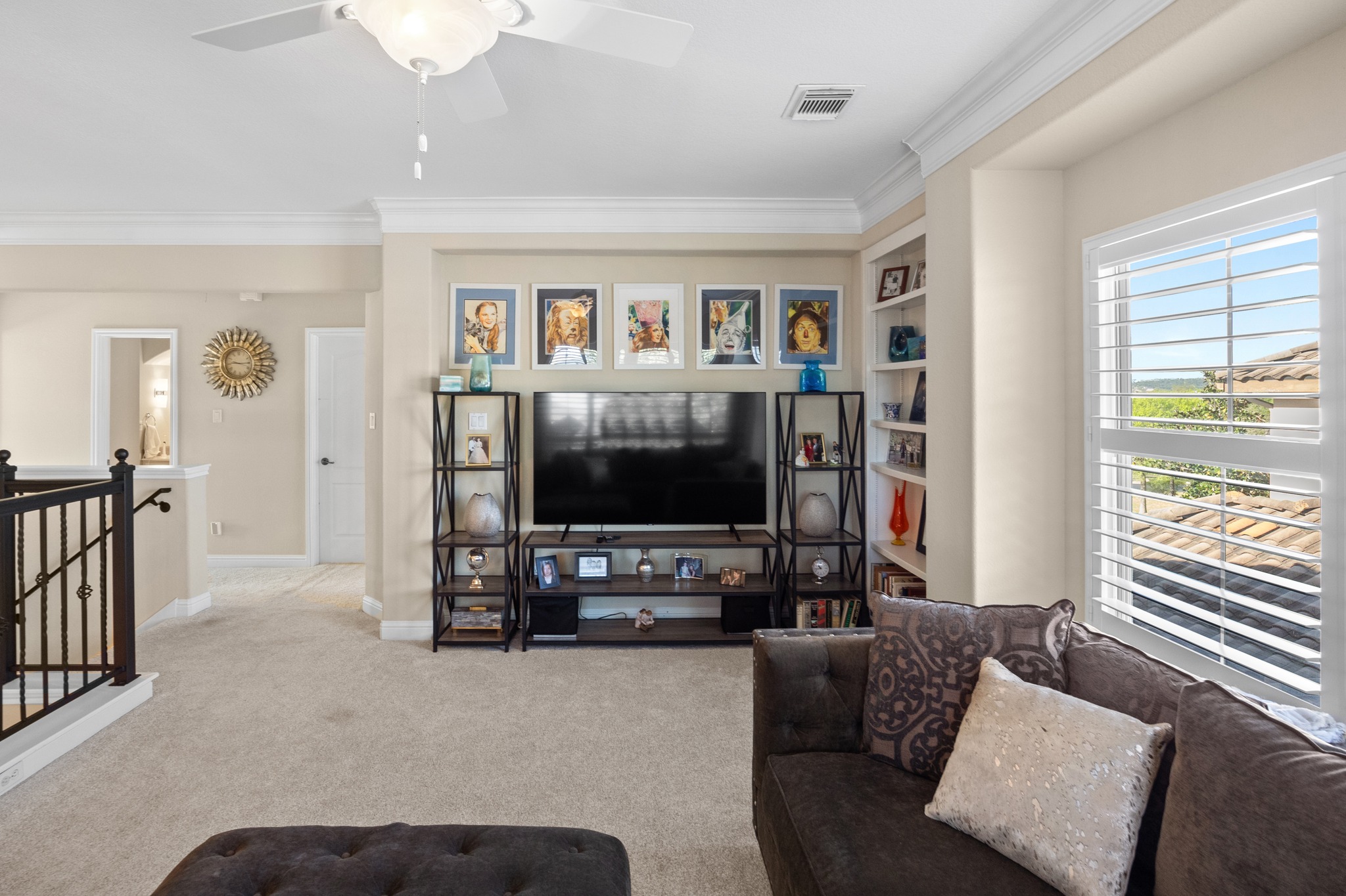 4 Hightrail Way The Hills, TX 78738 - Photo 18 of 35 a living room with furniture and a flat screen tv
