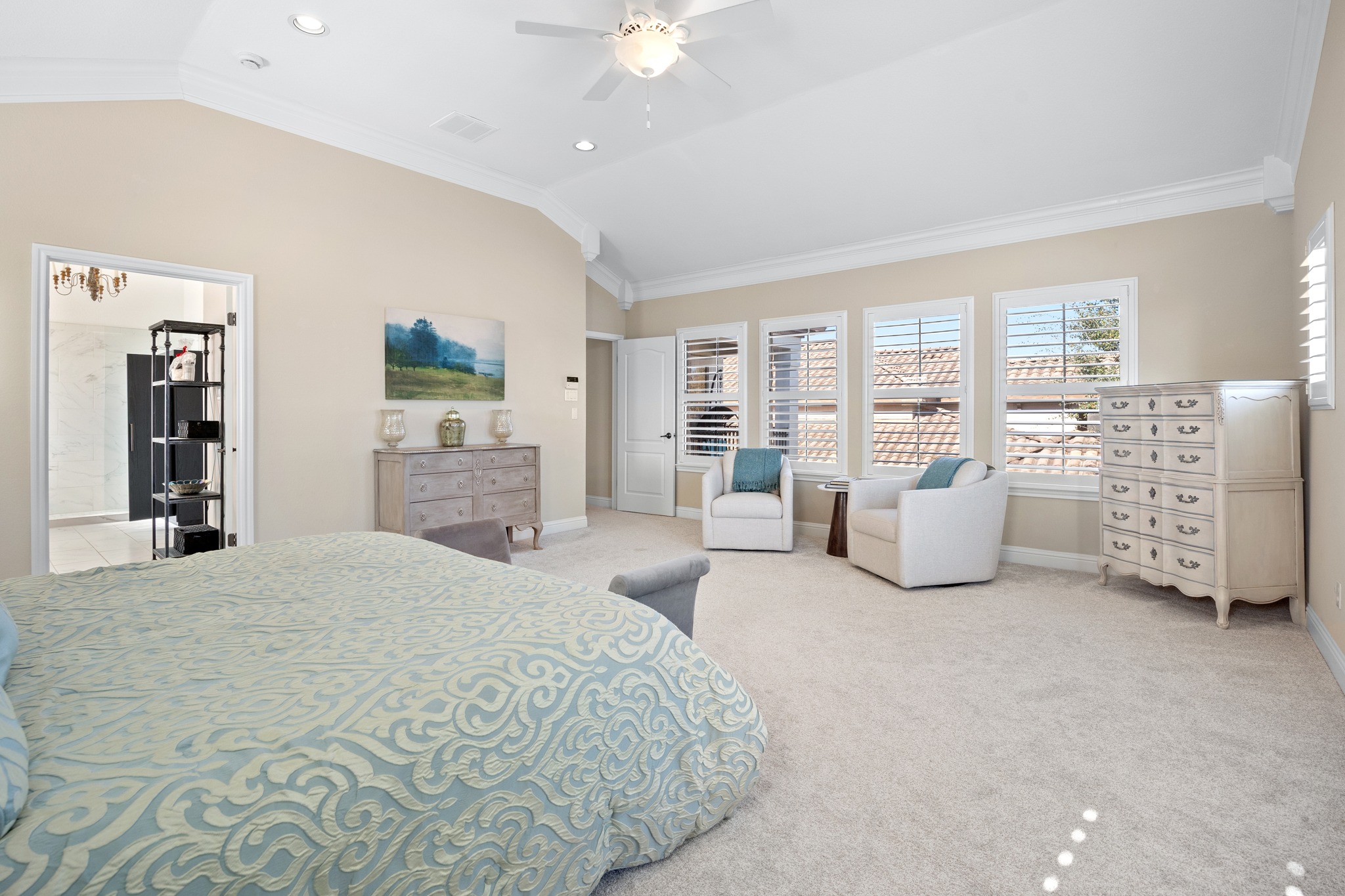 4 Hightrail Way The Hills, TX 78738 - Photo 20 of 35 a spacious bedroom with a bed furniture and a large window
