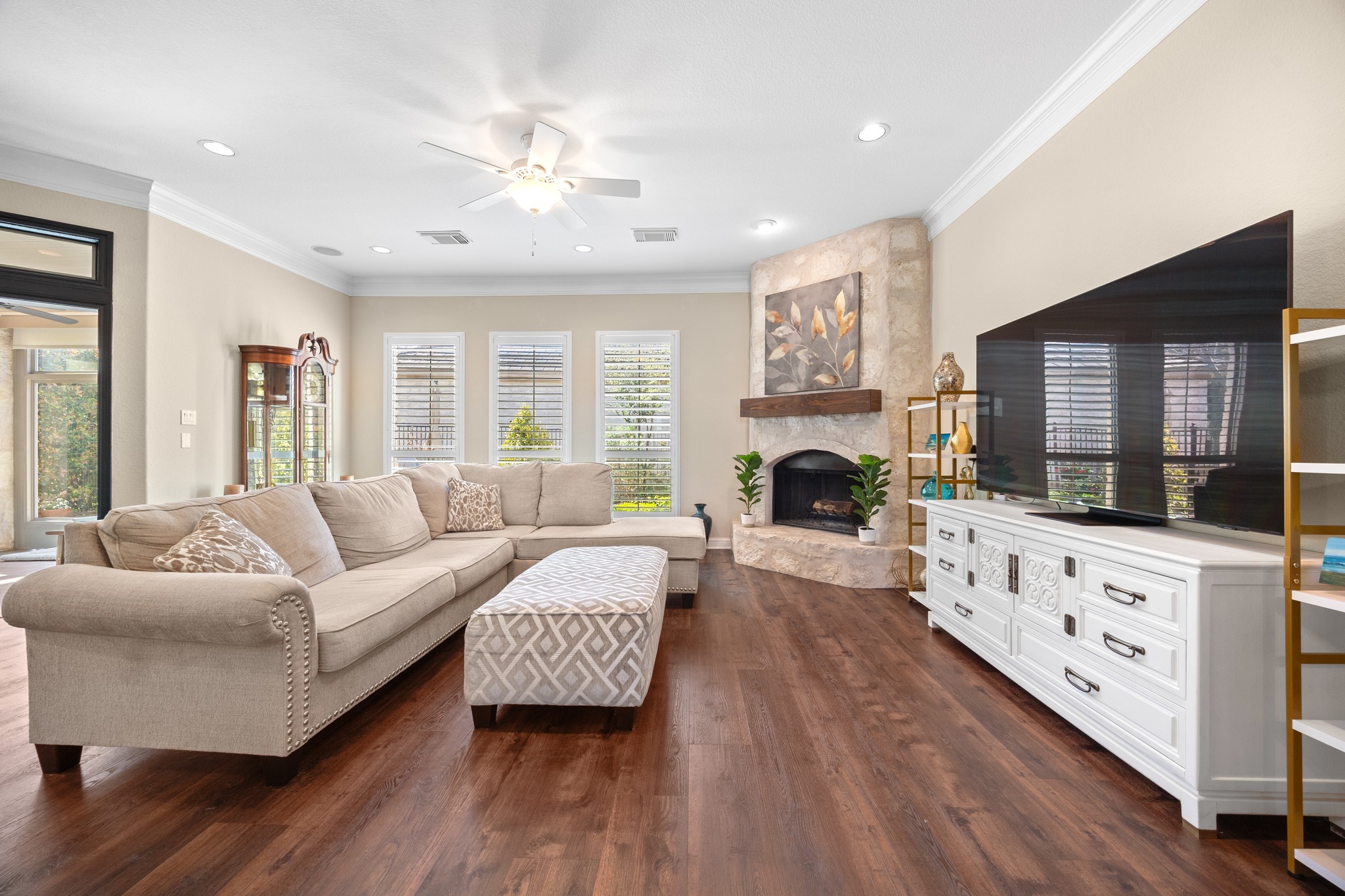 4 Hightrail Way The Hills, TX 78738 - Photo 2 of 35 a living room with furniture fireplace and flat screen tv