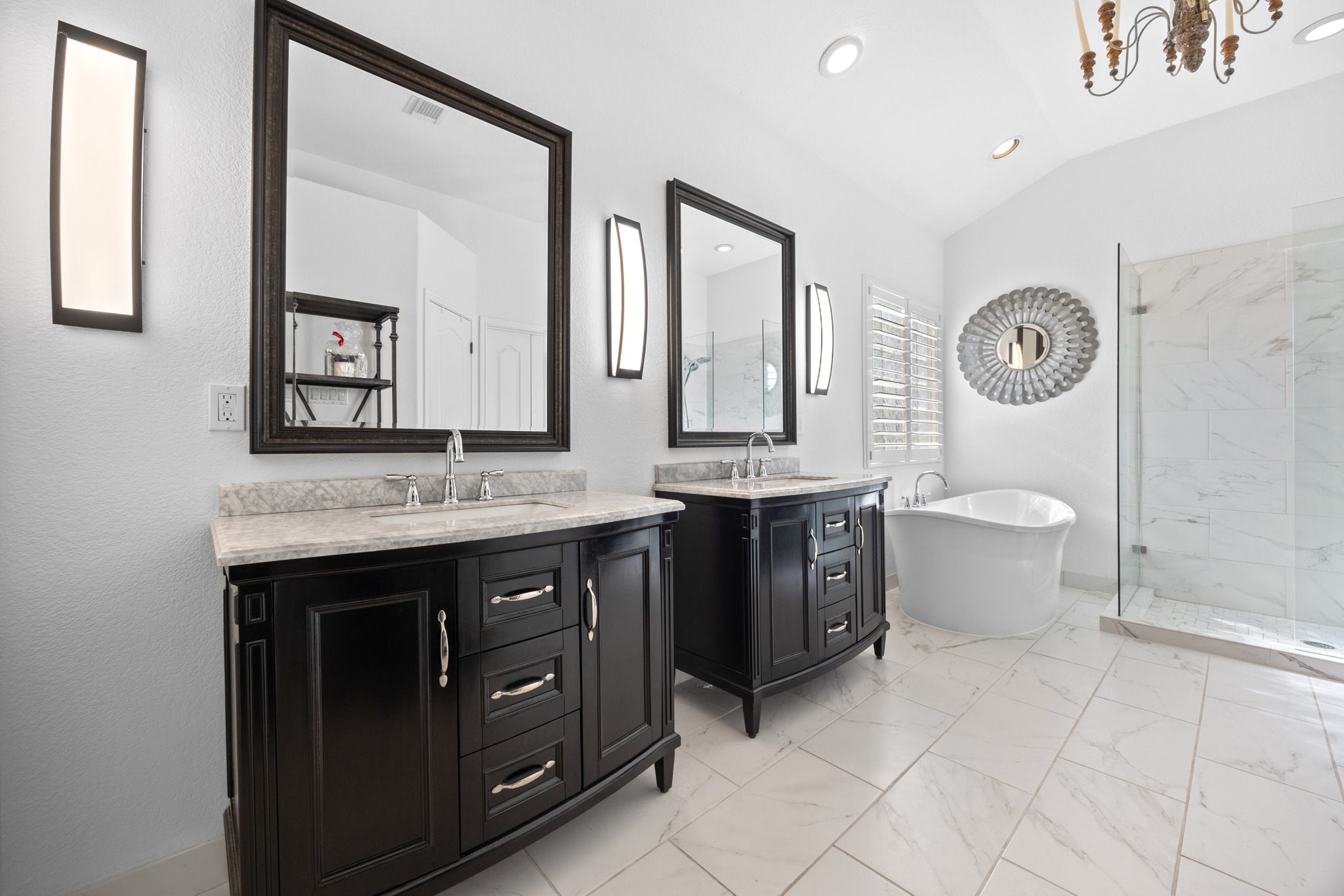 4 Hightrail Way The Hills, TX 78738 - Photo 21 of 35 a bathroom with a double vanity sink and a mirror