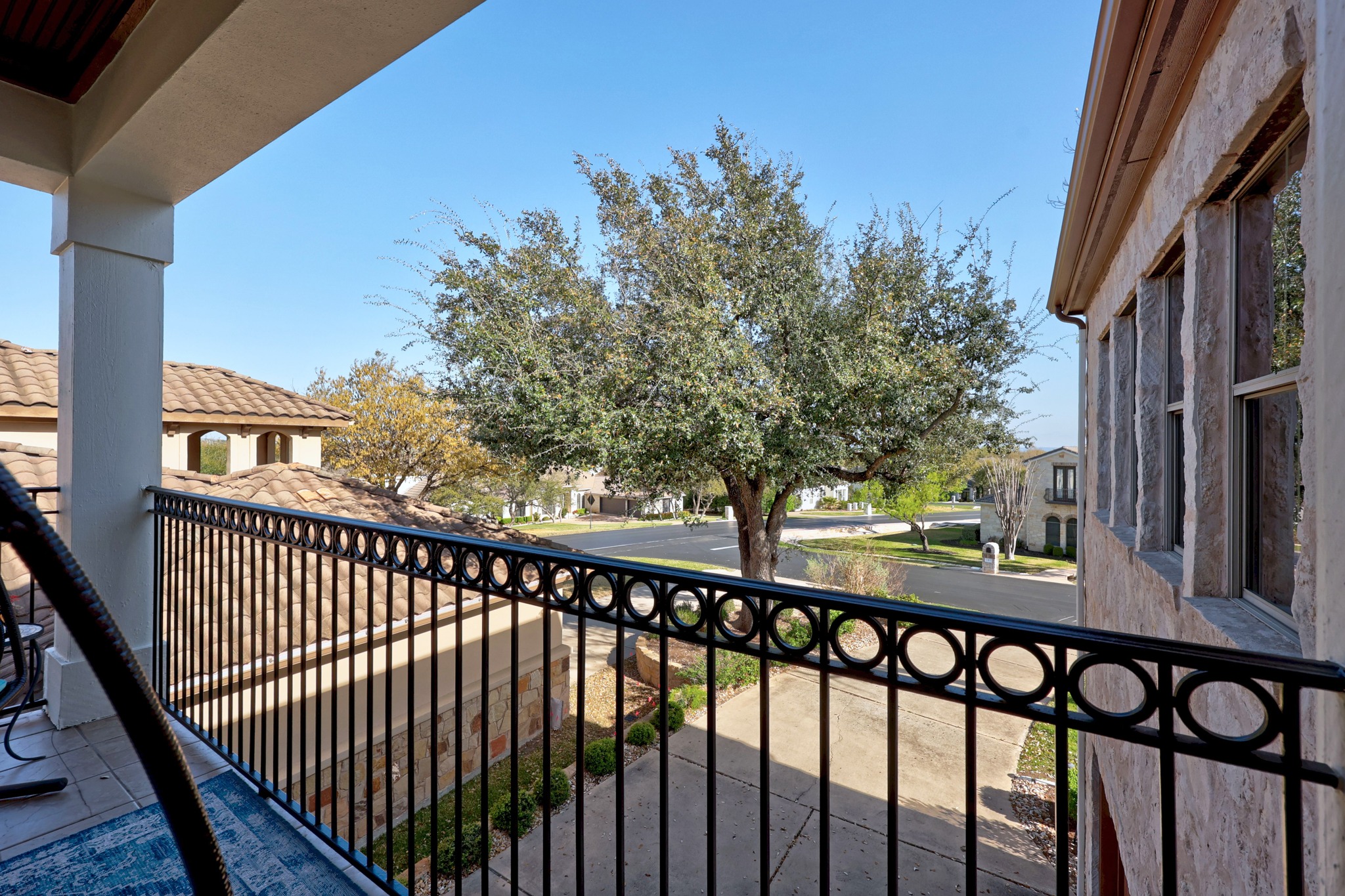 4 Hightrail Way The Hills, TX 78738 - Photo 28 of 35 a view of a balcony with wooden fence and floor