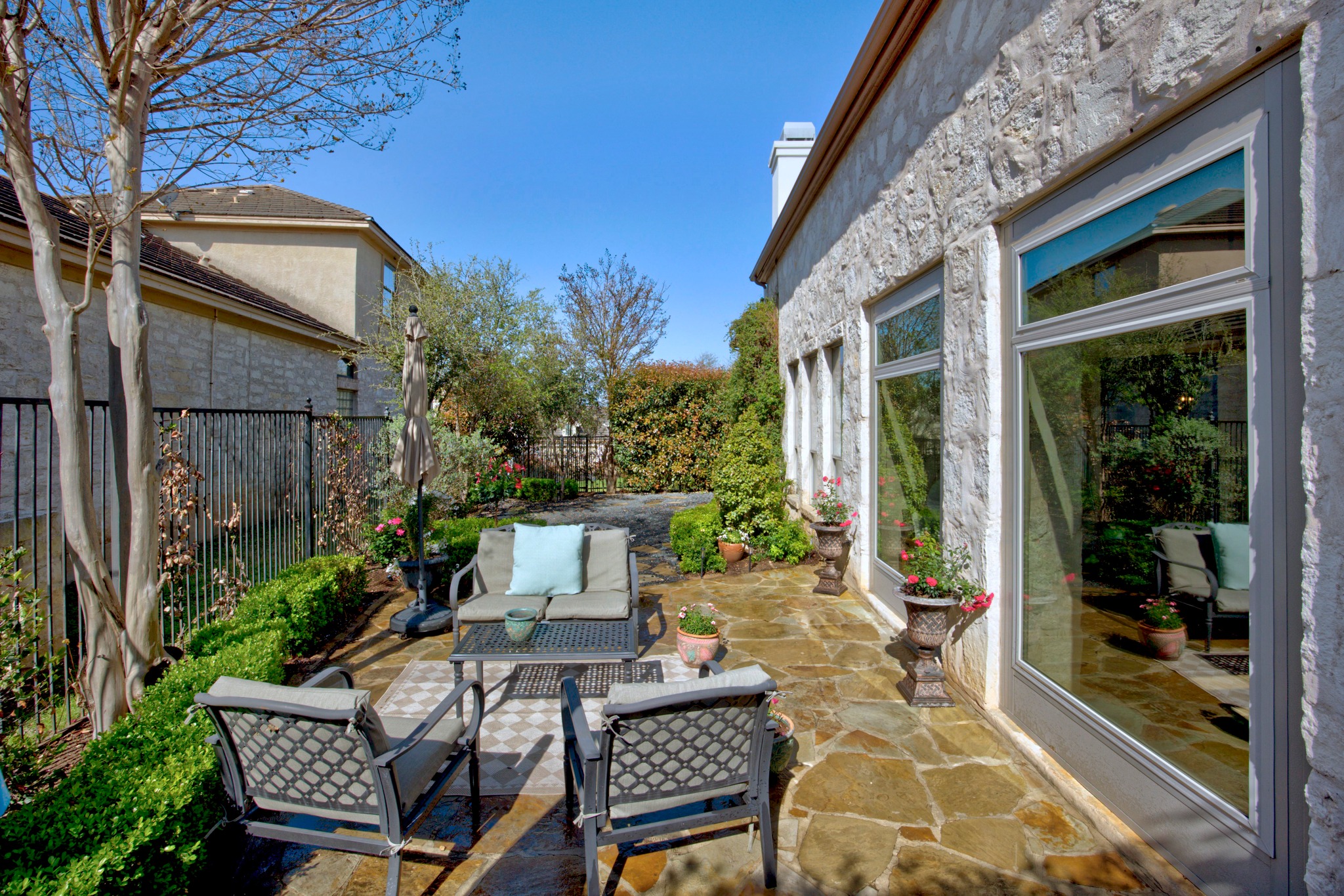 4 Hightrail Way The Hills, TX 78738 - Photo 33 of 35 a view of a patio with table and chairs and potted plants