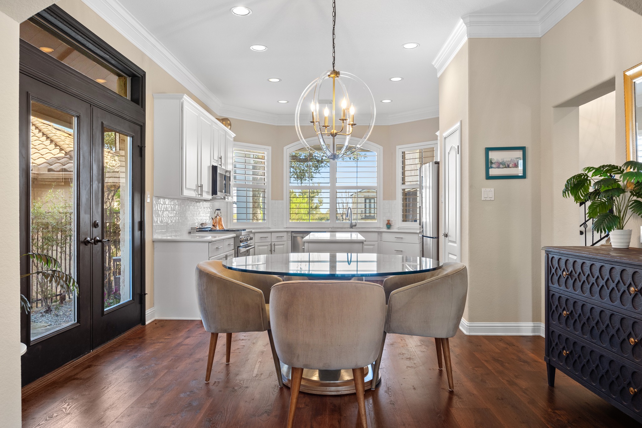4 Hightrail Way The Hills, TX 78738 - Photo 10 of 35 a dining room with furniture a chandelier and wooden floor