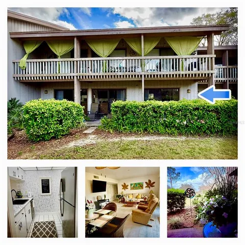 a view of a house with a small deck and a garden