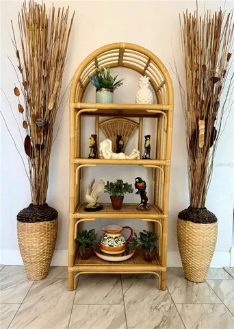 a view of living room filled with furniture and a potted plant