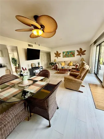 a living room with fireplace furniture and a flat screen tv