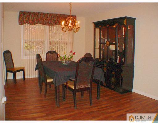 49 Meredith Road Edison, NJ 08817 - Photo 3 of 18 a view of a dining room with furniture and chandelier