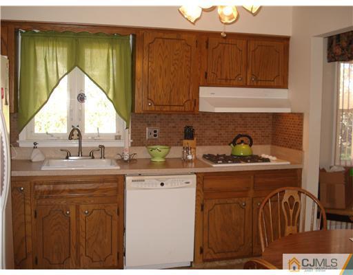 49 Meredith Road Edison, NJ 08817 - Photo 5 of 18 a kitchen with a sink a cabinets and window