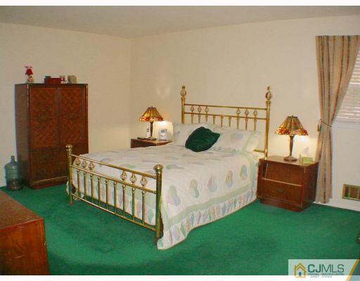 49 Meredith Road Edison, NJ 08817 - Photo 8 of 18 a bedroom with a bed and a window