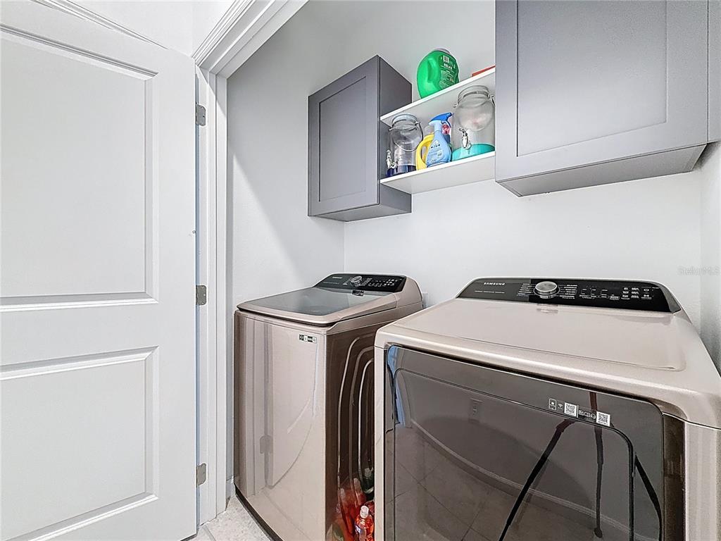 2030 Hemingway Circle Groveland, FL 34736 - Photo 12 of 21 a utility room with dryer and washer