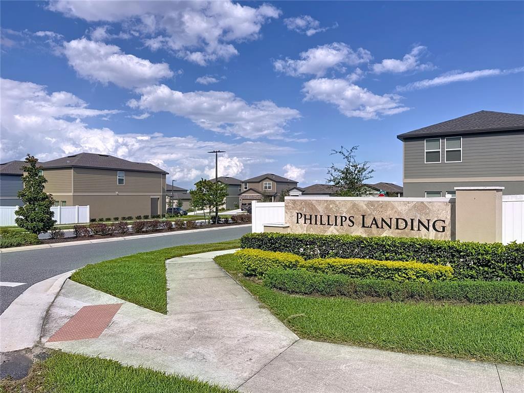 2030 Hemingway Circle Groveland, FL 34736 - Photo 17 of 21 a front view of a house with a garden