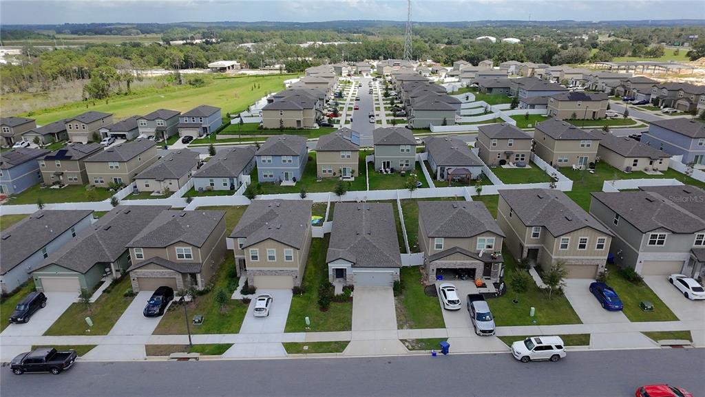 2030 Hemingway Circle Groveland, FL 34736 - Photo 19 of 21 an aerial view of residential houses with outdoor space