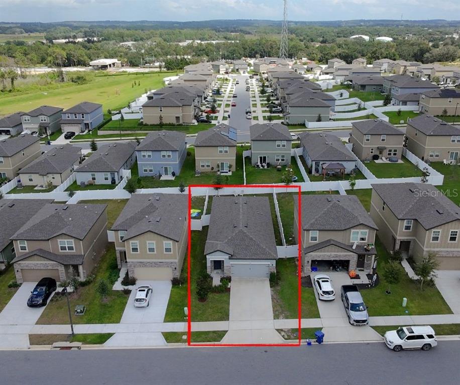 2030 Hemingway Circle Groveland, FL 34736 - Photo 20 of 21 an aerial view of residential houses with outdoor space