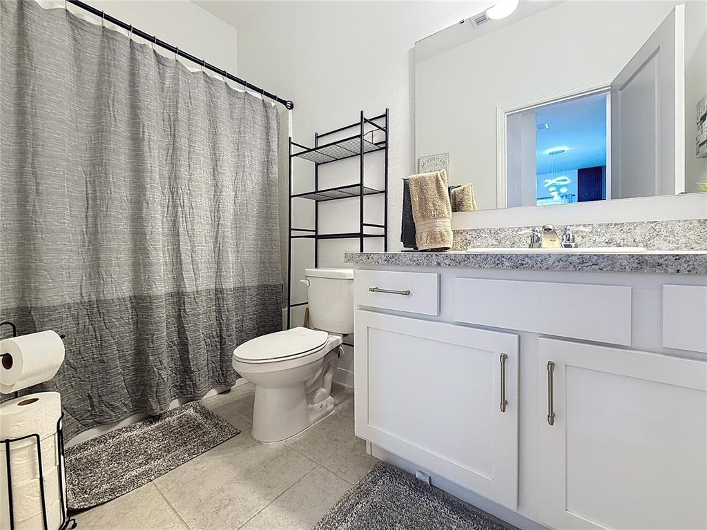 2030 Hemingway Circle Groveland, FL 34736 - Photo 8 of 21 a bathroom with a sink a toilet and shower