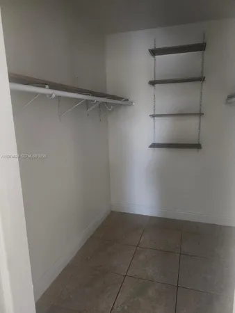 a view of a room with racks on the wall