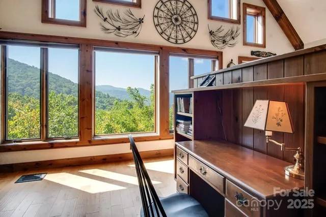 a view of a room with furniture and a window