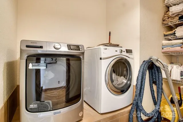 a utility room with dryer and washer