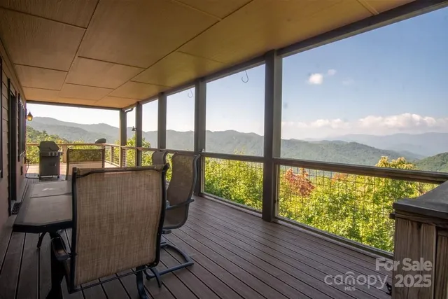 a view of a room with wooden floor and furniture
