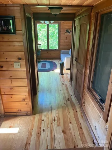 a view of a hardwood and front door
