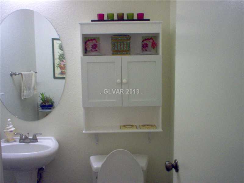 9133 Ripple Ridge Avenue, Unit 102 Las Vegas, NV 89149 - Photo 12 of 18 Guest Bathroom. downstairs 1/2 bath