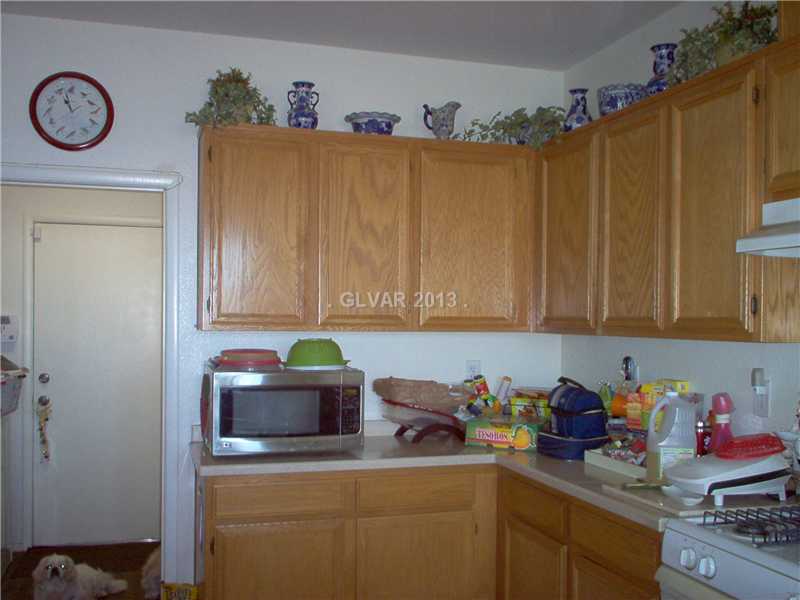 9133 Ripple Ridge Avenue, Unit 102 Las Vegas, NV 89149 - Photo 3 of 18 Kitchen. Kitchen Cabinets