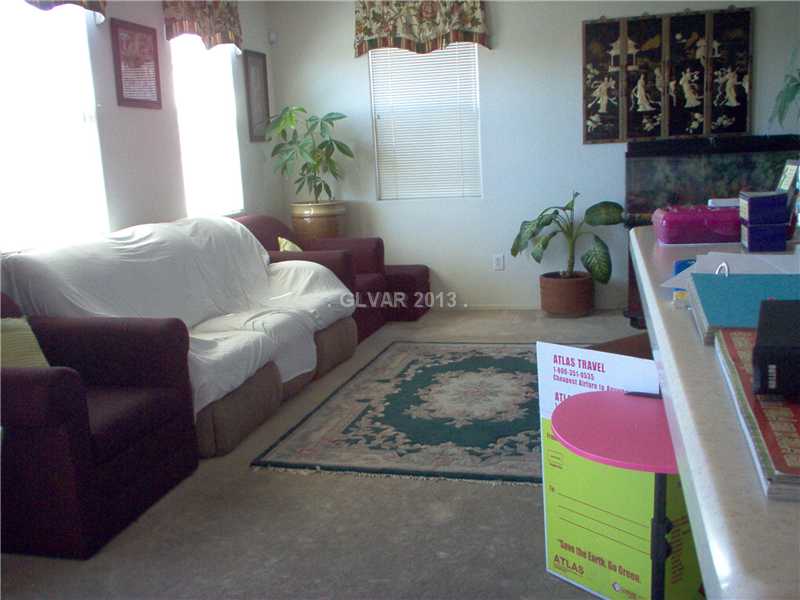 9133 Ripple Ridge Avenue, Unit 102 Las Vegas, NV 89149 - Photo 6 of 18 Living Room.