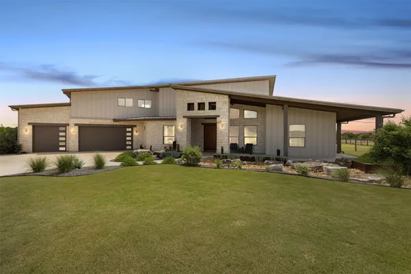 front view of a house with a yard