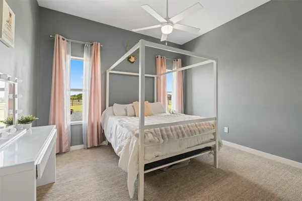 a bed room with a bed and a chandelier