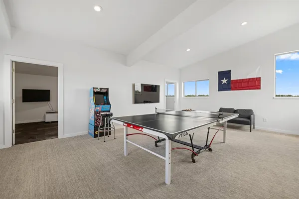 a room with furniture and a flat screen tv