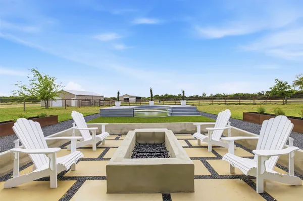 a view of swimming pool with seating space