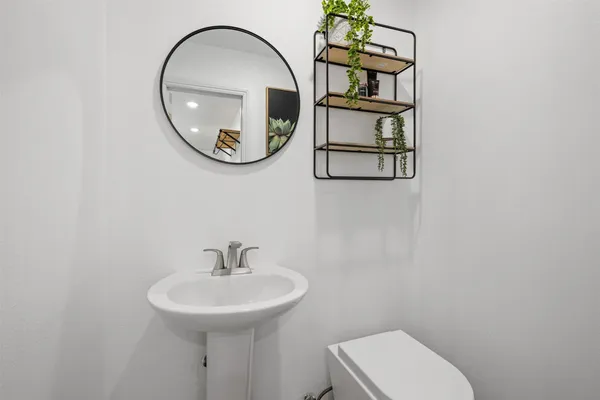 a bathroom with a toilet and a sink