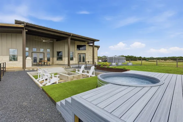 a view of a house with swimming pool and porch