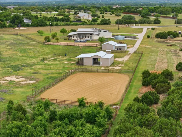 an aerial view of a house with a lake view